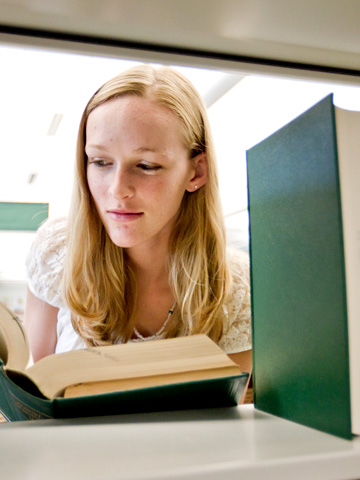 Girl looking at book